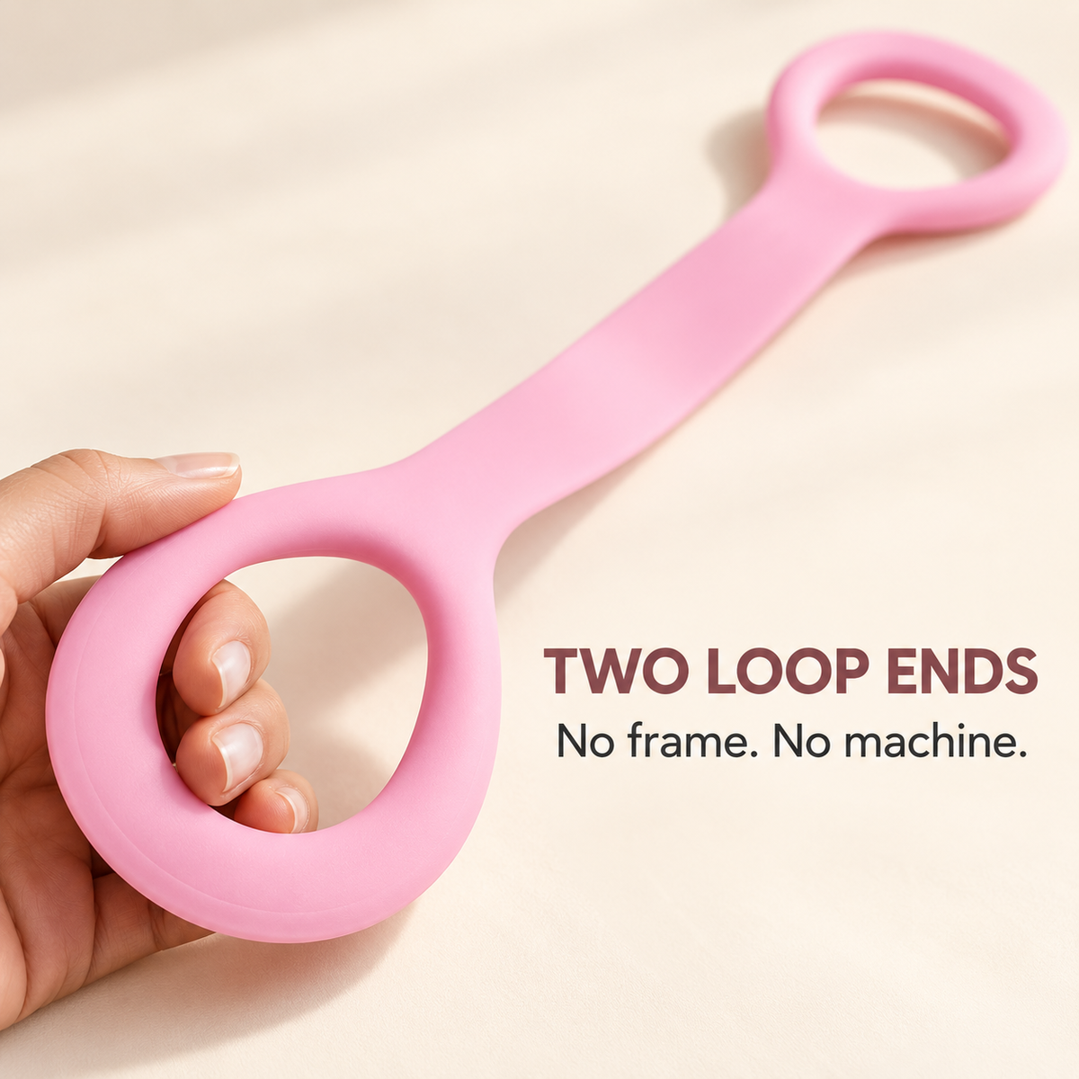 Close view of a representative pink figure-8 band with two loop handles and no machine