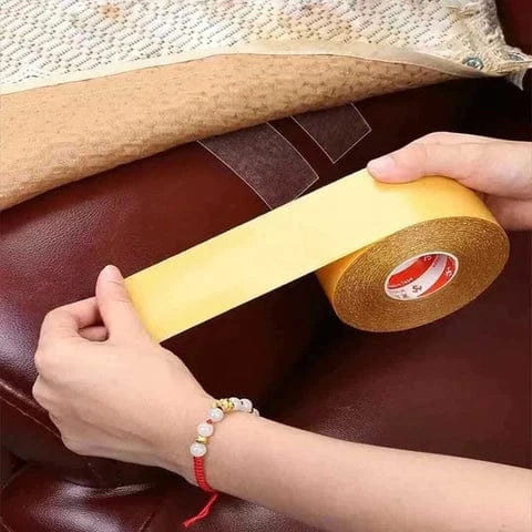 Placing double-sided carpet tape underneath a rug edge