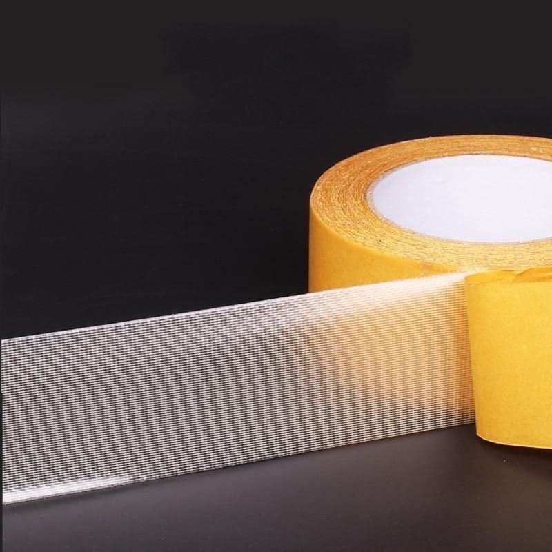 Close-up of mesh-backed carpet tape and protective liner