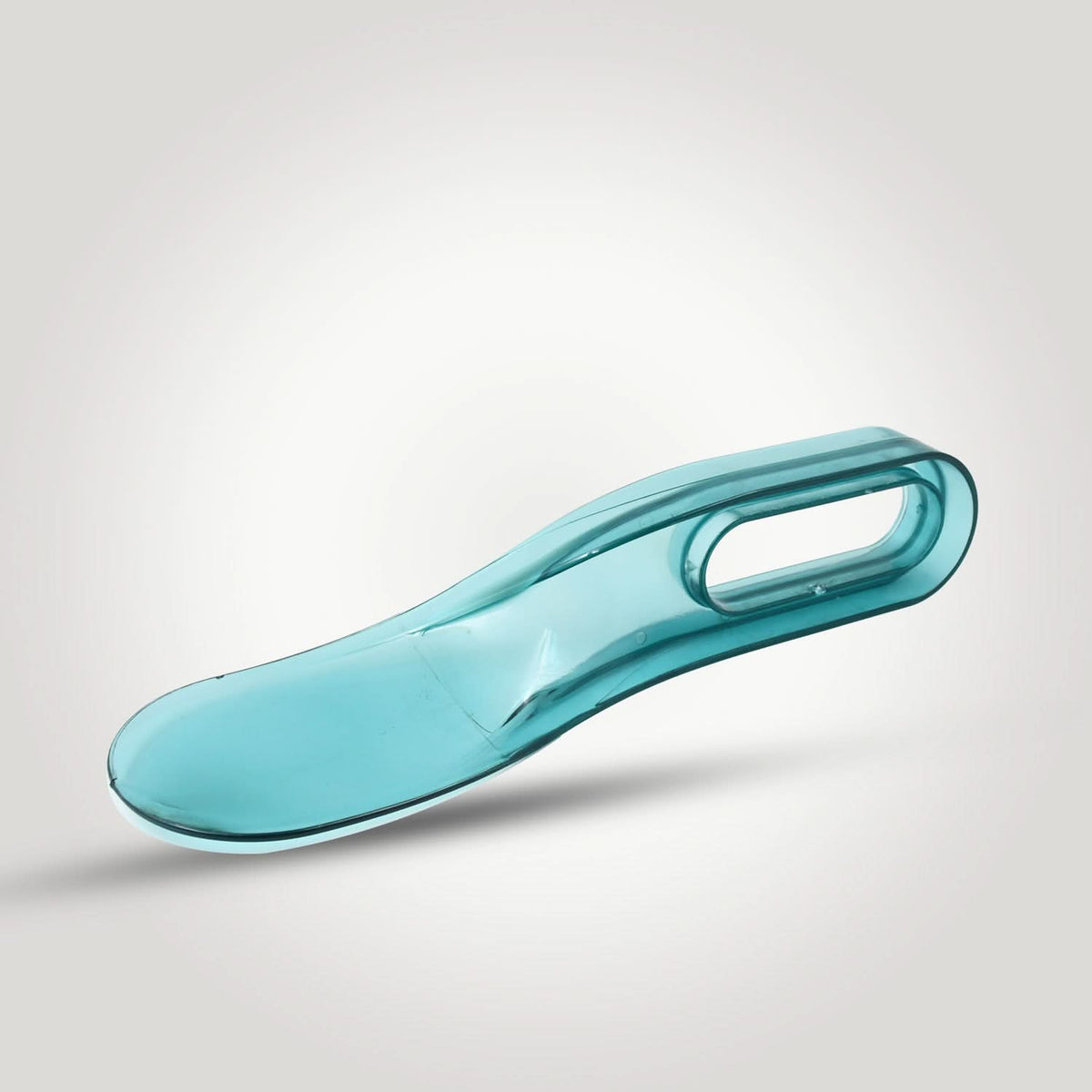 Bedsheet lifter tool in use while making a bed