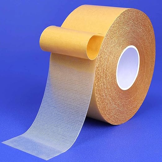 Double-sided mesh carpet tape roll with peel-away protective liner